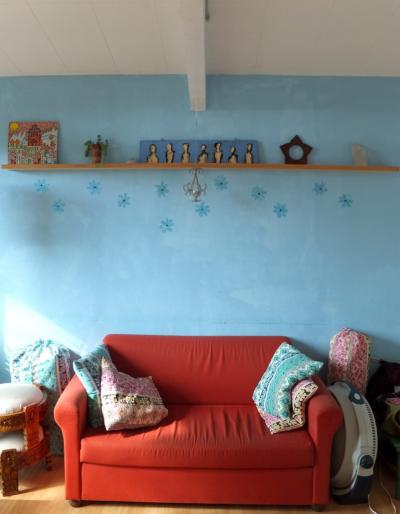 The art shelf, mounted high on the wall