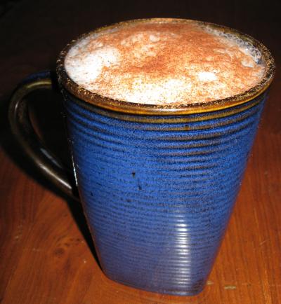 Chai Latte topped with ground cinnamon and cocoa powder