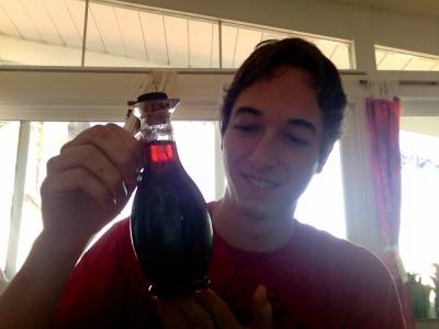 Adam holding a bottle of vanilla syrup