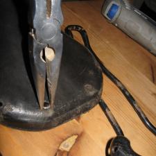 removing ground rivets with pliers