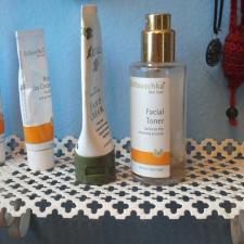 the cute little white shelf is a great addition to our bathroom